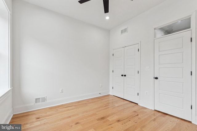 unfurnished bedroom featuring ceiling fan and light wood-type flooring