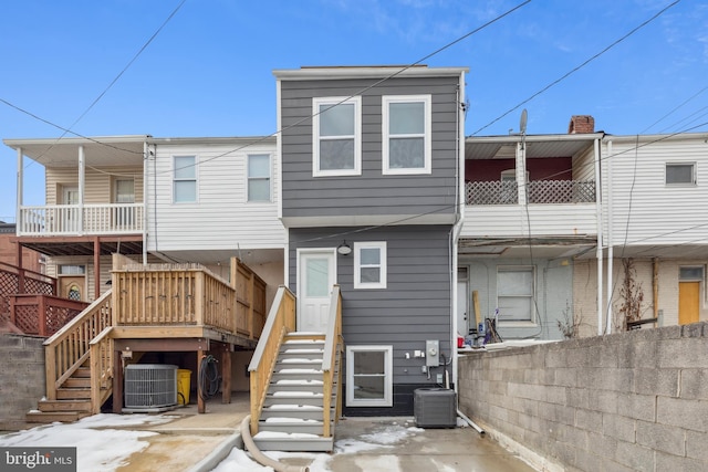 back of property with central air condition unit