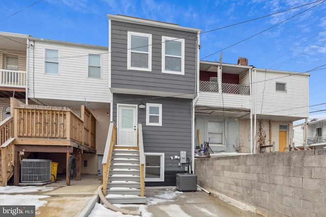 back of house featuring central AC