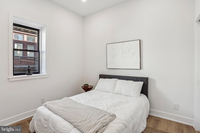 bedroom featuring hardwood / wood-style floors