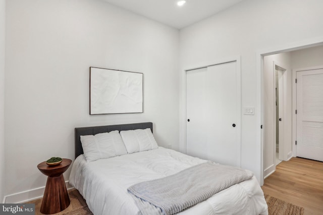 bedroom with hardwood / wood-style flooring