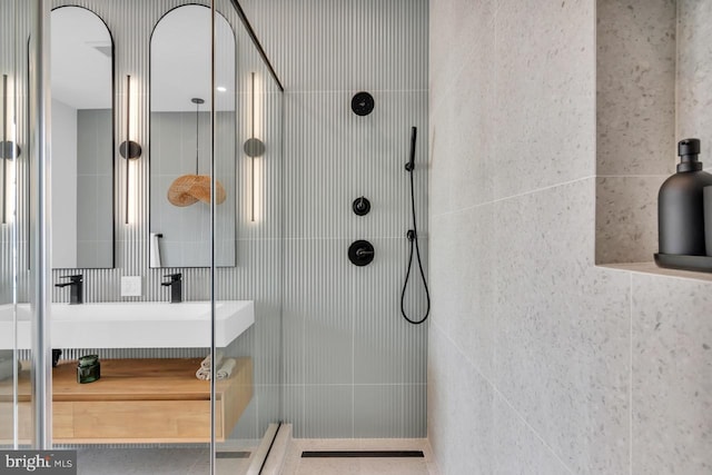 bathroom with a tile shower