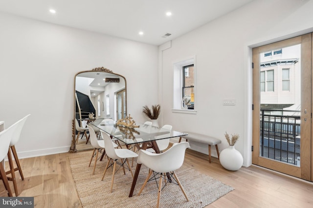 dining space featuring light hardwood / wood-style floors