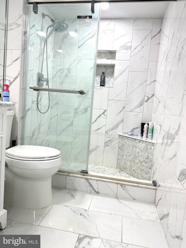 bathroom with an enclosed shower and toilet