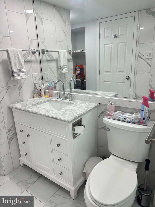 bathroom with toilet and vanity