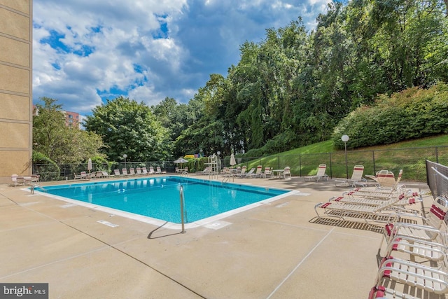 view of swimming pool with a patio