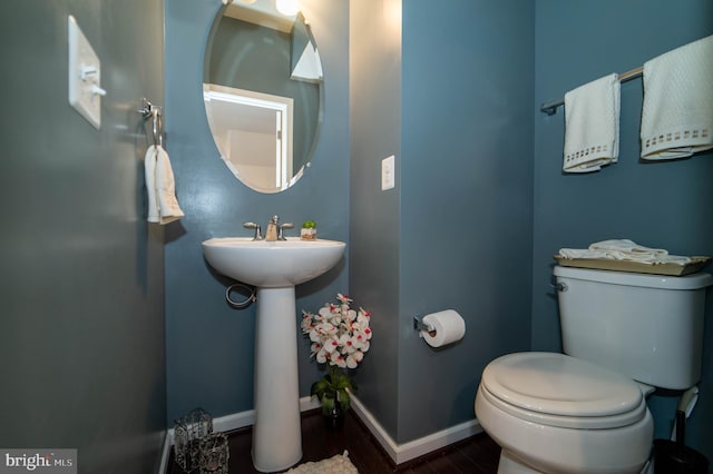 bathroom with toilet and sink