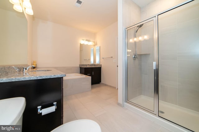 bathroom featuring vanity, tile patterned floors, and shower with separate bathtub