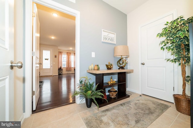 entryway featuring light tile patterned flooring