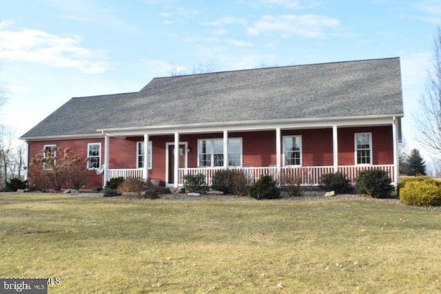 view of front of property featuring a front lawn and covered porch