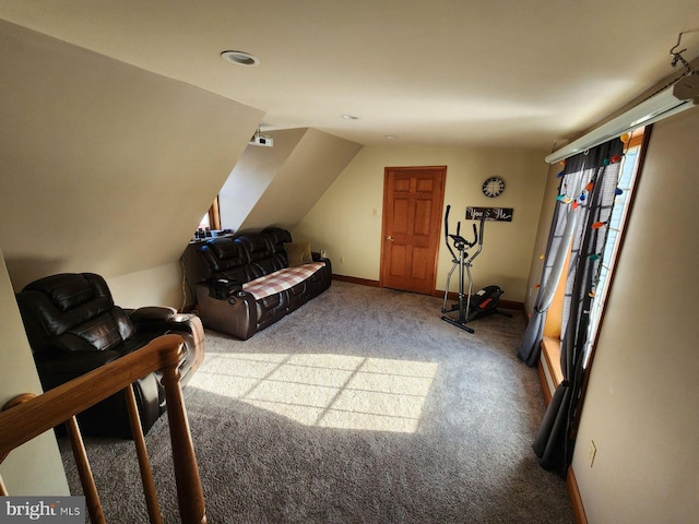 carpeted living room featuring lofted ceiling