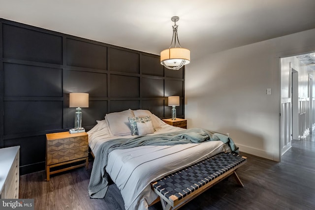 bedroom featuring dark hardwood / wood-style flooring