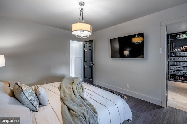 bedroom with hardwood / wood-style flooring