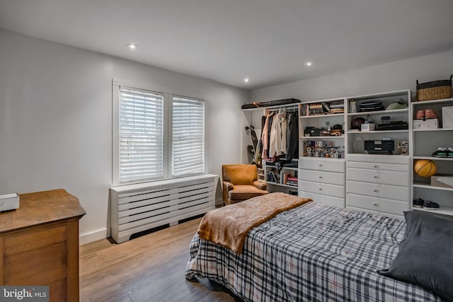 bedroom with light hardwood / wood-style floors