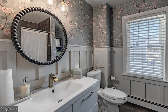 bathroom featuring tile patterned flooring, a baseboard heating unit, vanity, toilet, and a shower with shower curtain