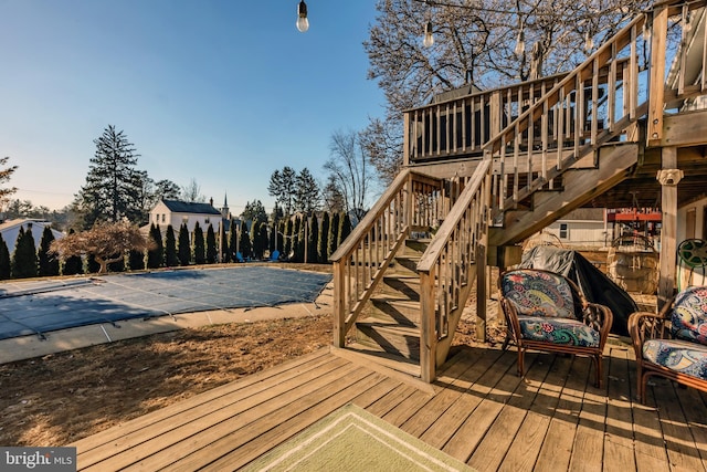 wooden terrace featuring a covered pool