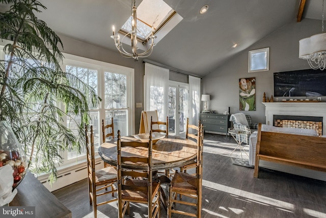 dining space with a baseboard radiator, a notable chandelier, dark wood-type flooring, a fireplace, and vaulted ceiling with beams