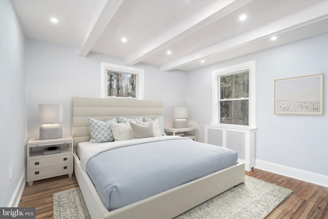 bedroom featuring beam ceiling and wood-type flooring