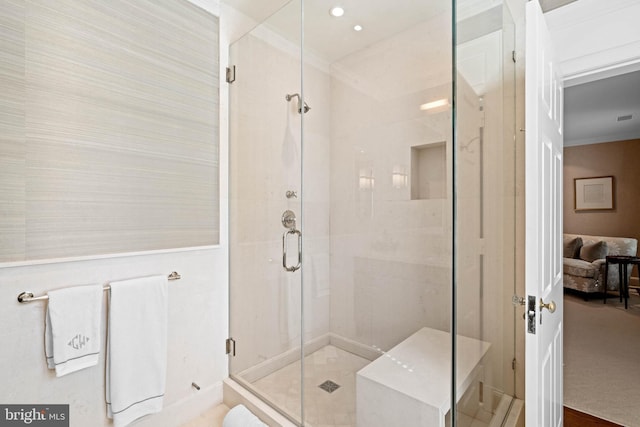 bathroom with walk in shower and crown molding