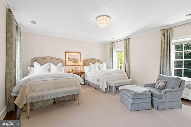 bedroom with ornamental molding, carpet flooring, and multiple windows