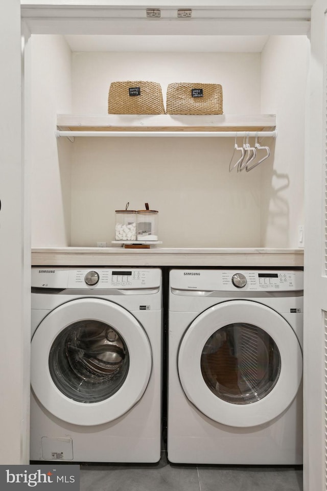 laundry area featuring washing machine and dryer