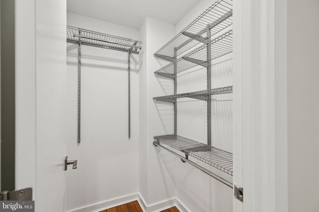 spacious closet with wood finished floors