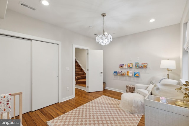 interior space with a closet, visible vents, wood finished floors, and recessed lighting