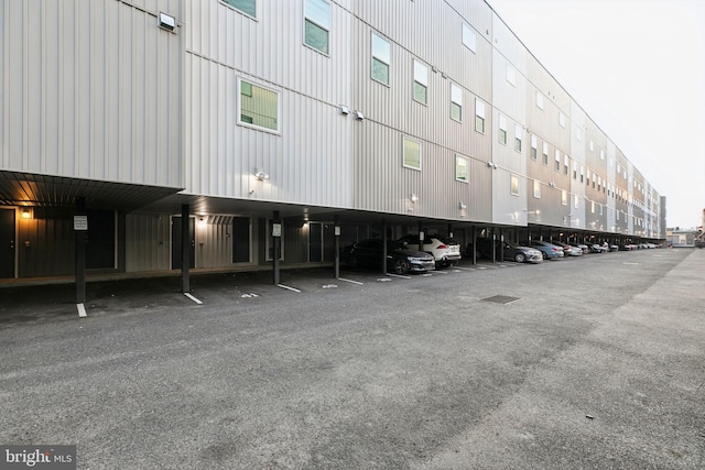 view of building exterior featuring covered parking