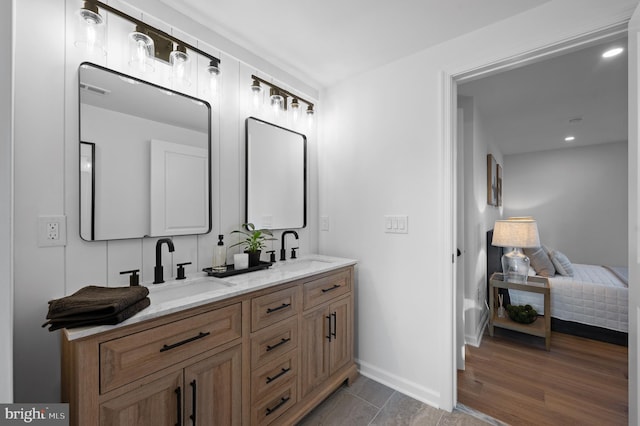 bathroom featuring vanity and hardwood / wood-style floors