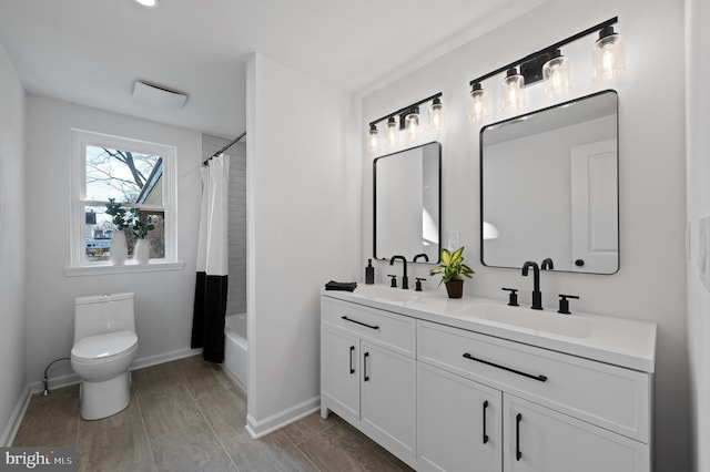 full bathroom featuring vanity, toilet, and shower / bath combo with shower curtain