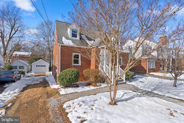 view of front of home featuring a garage and an outdoor structure