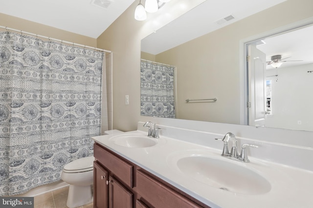 bathroom with ceiling fan, tile patterned flooring, vanity, a shower with curtain, and toilet