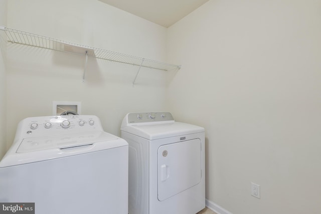 laundry area featuring washing machine and dryer