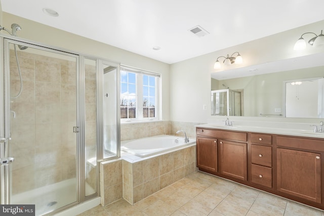 bathroom featuring vanity, tile patterned floors, and separate shower and tub