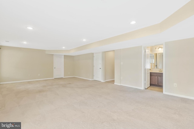 basement with light colored carpet