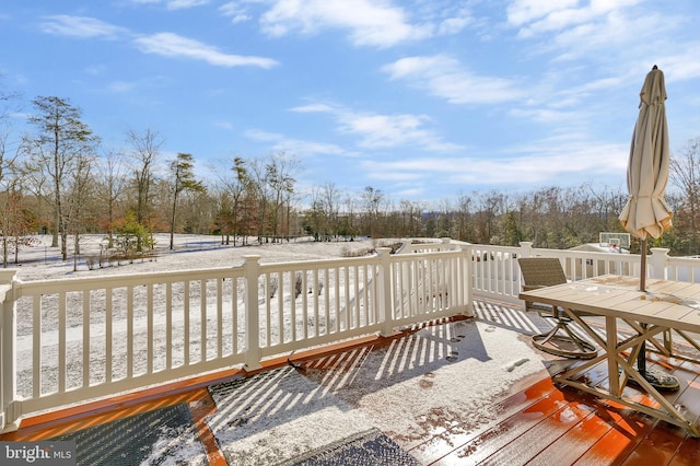 view of snow covered deck