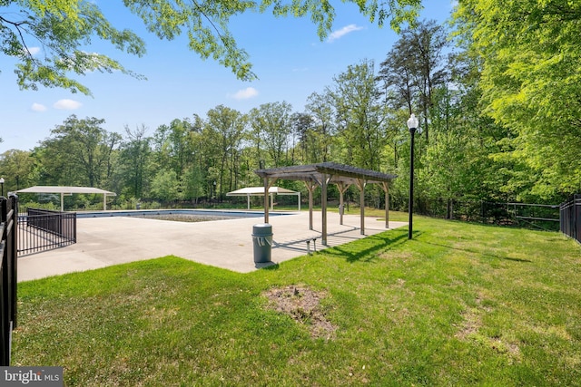 view of home's community with a pool, a lawn, a patio area, and a pergola