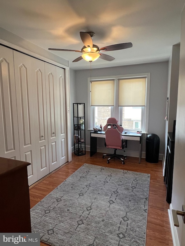 office with ceiling fan and hardwood / wood-style floors