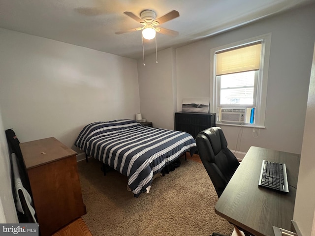 bedroom featuring ceiling fan, cooling unit, and carpet floors