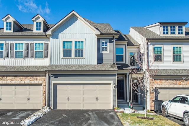 townhome / multi-family property featuring a garage