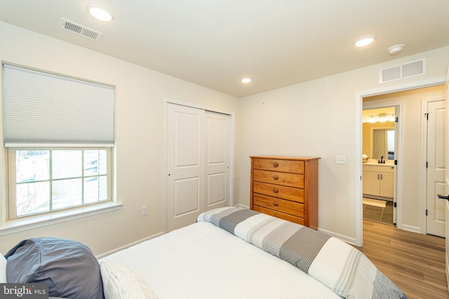 bedroom featuring a closet and light hardwood / wood-style floors