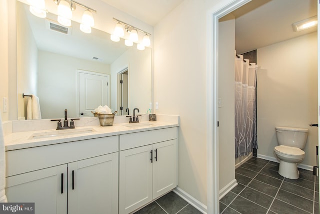 bathroom featuring toilet, tile patterned floors, a shower with shower curtain, and vanity