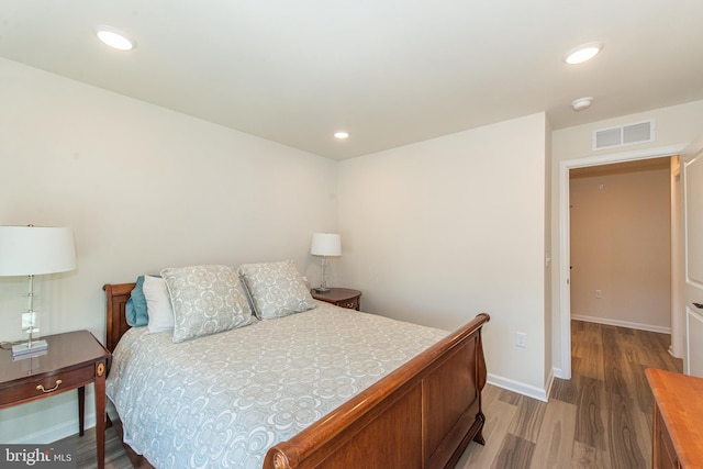 bedroom featuring wood-type flooring