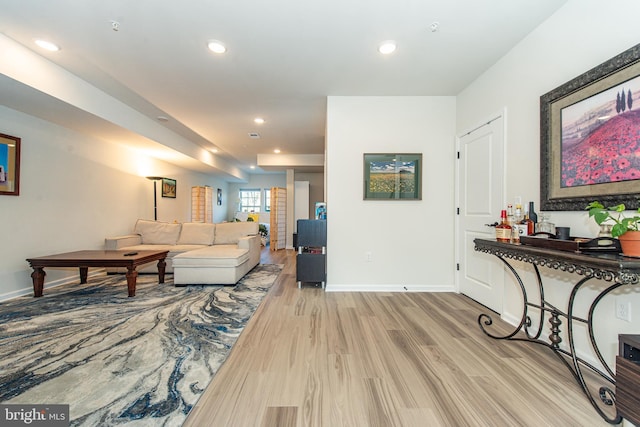 living room with light hardwood / wood-style flooring