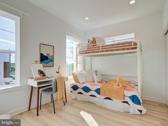 bedroom with light wood-type flooring