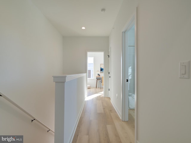 corridor featuring light hardwood / wood-style floors