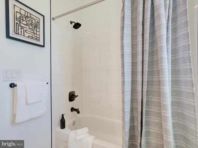 bathroom featuring shower / bath combo with shower curtain