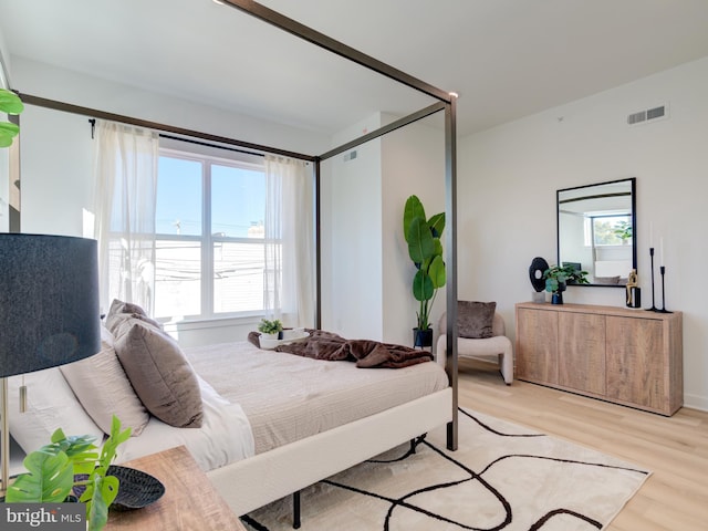 bedroom with light hardwood / wood-style floors