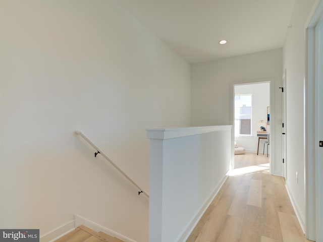 hall with light hardwood / wood-style flooring