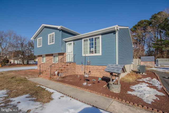 tri-level home with a storage unit and central AC unit